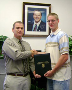 George F. Belanger presenting Taylor Motta the James P. Hoffa Scholarship